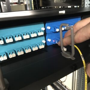 a Shoreworx technician working on fiber optic cabling for a client