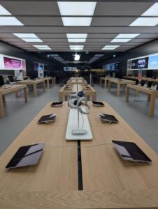 Apple store tables with devices installed on tables